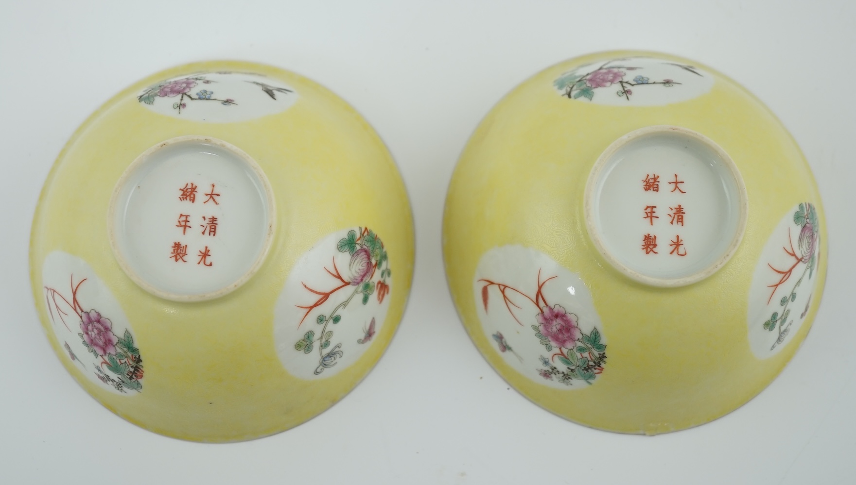 A pair of Chinese yellow sgraffito ground medallion bowls, Guangxu mark, early 20th century